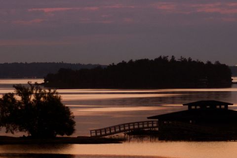 Sunset with small islands and boathouse