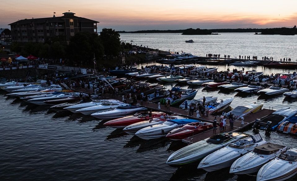 Speedboats from the 1000 Islands Charity Poker Run dock at 1000 Islands Harbor Hotel