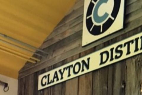 Close up on sign for Clayton Distillery